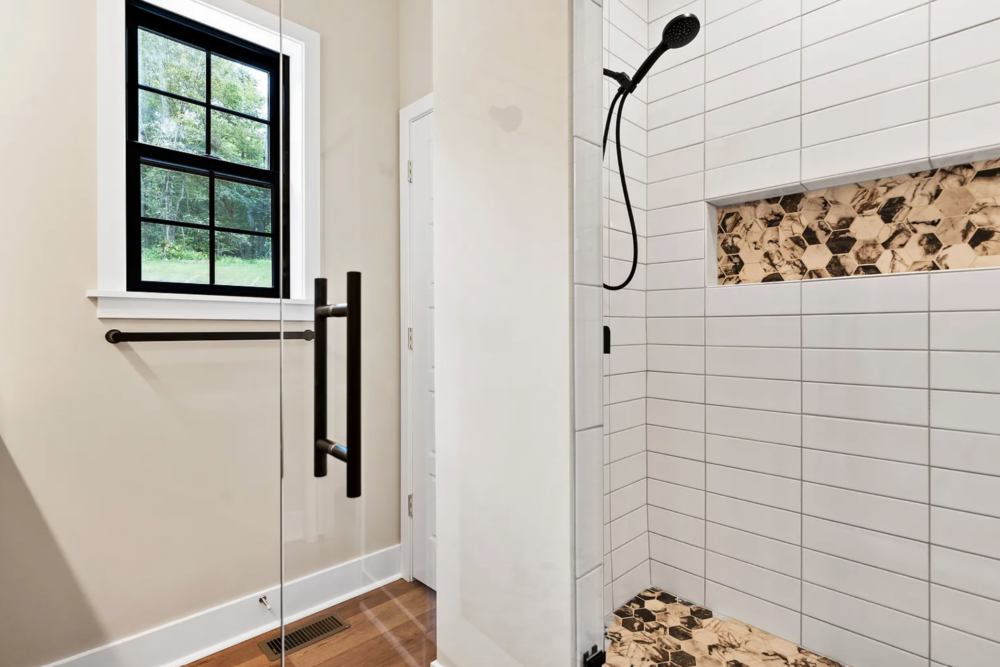 Newly built custom-tiled shower in a Rockville Estates home by Yingst Building Group in Marysville, Pennsylvania