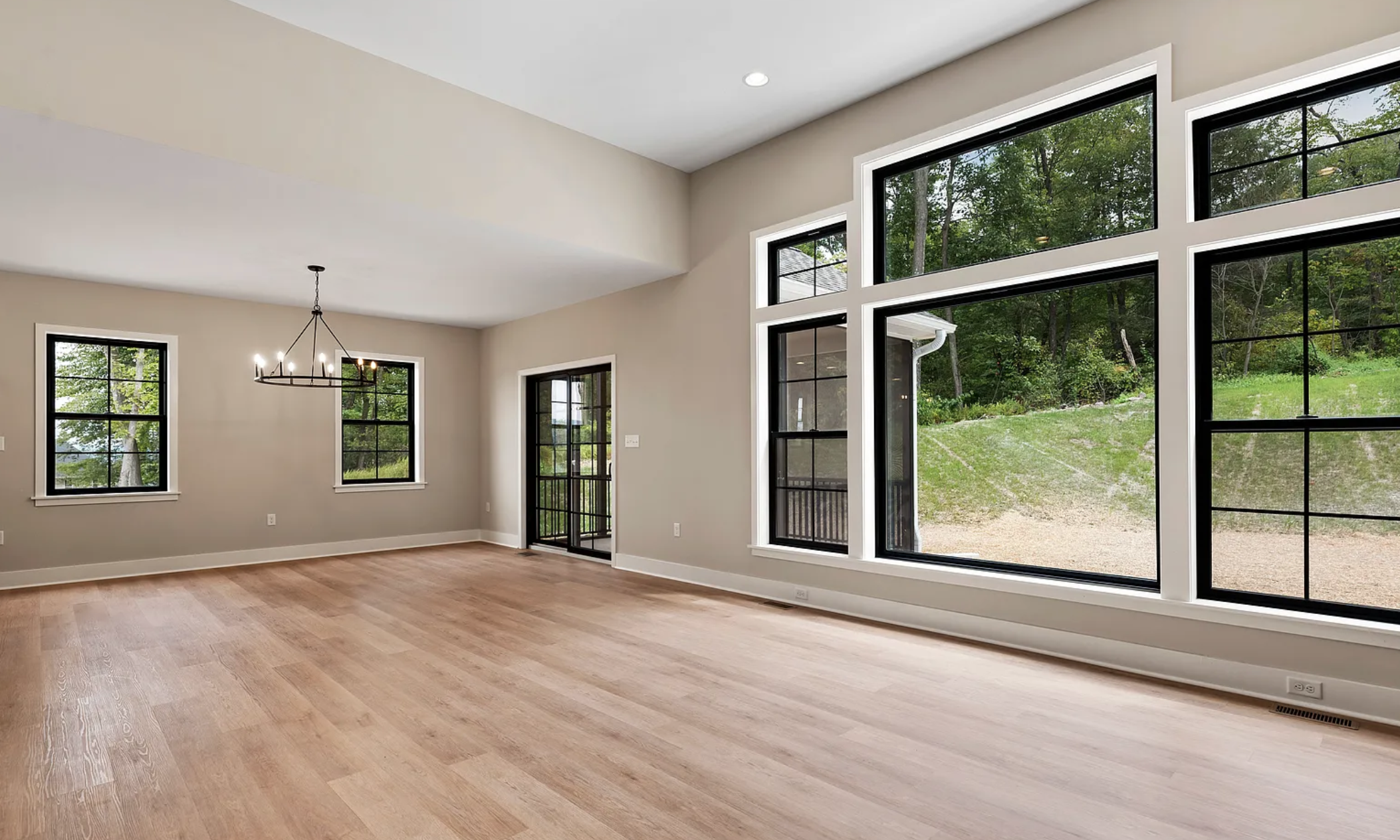 Spacious open floor plan with modern design and natural lighting in a home at Rockville Estates by Yingst Building Group
