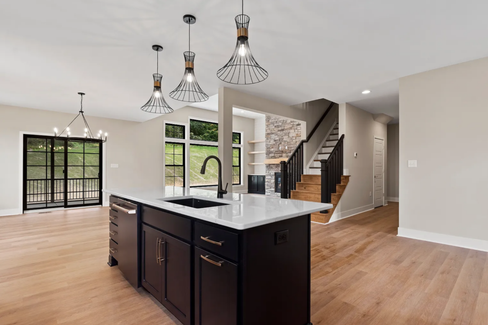 Kitchen island and staircase in a modern home at Rockville Estates, Marysville, PA
