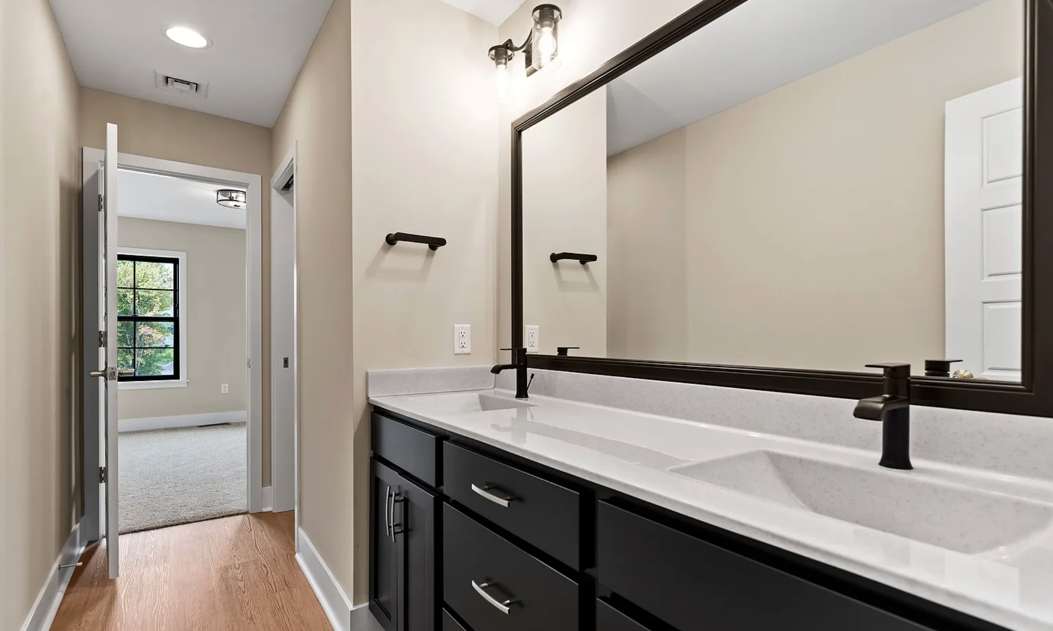 Bathroom interior with stylish vanity and modern fixtures in a Rockville Estates home by Yingst Building Group