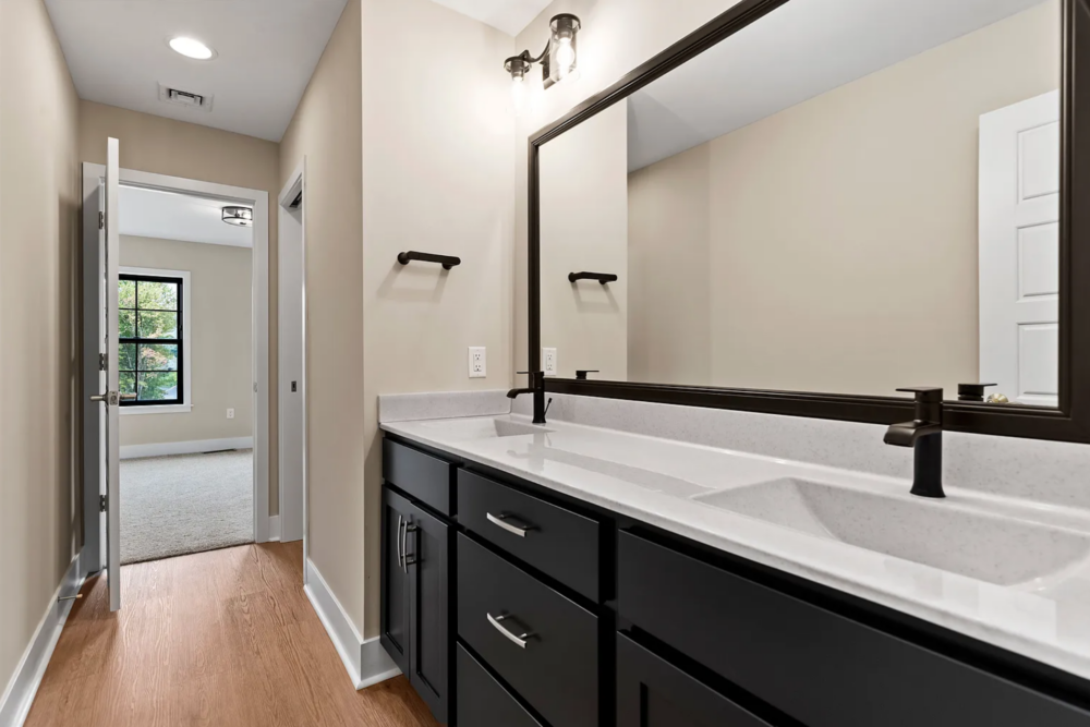Bathroom interior with stylish vanity and modern fixtures in a Rockville Estates home by Yingst Building Group