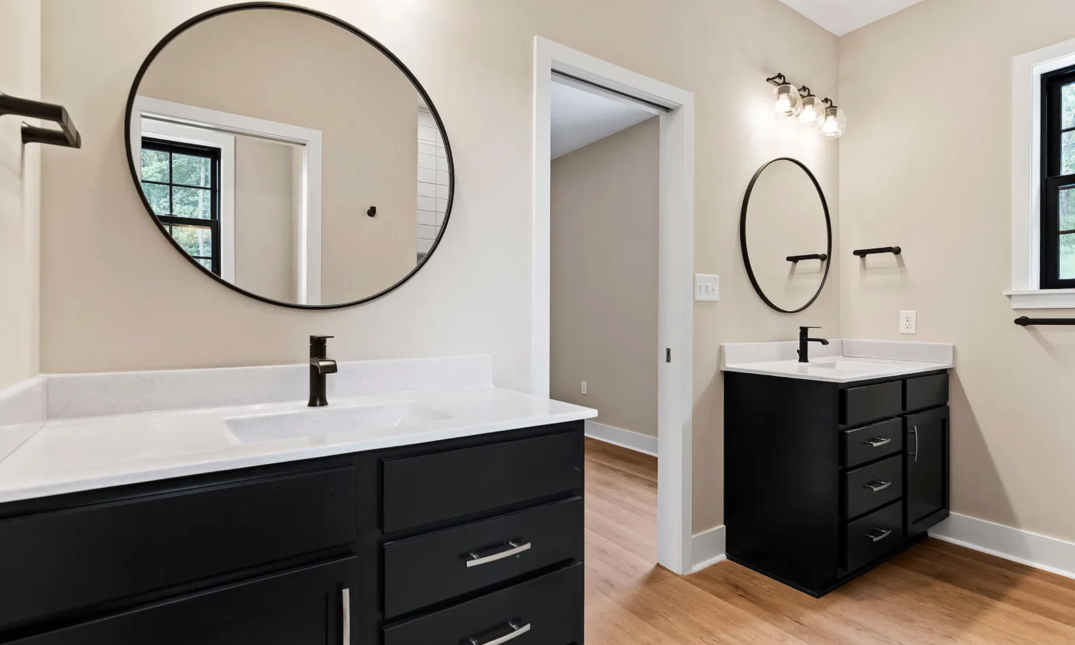 Primary suite bathroom with double vanity and modern finishes in a Rockville Estates home by Yingst Building Group
