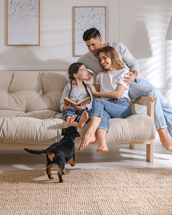 Happy family enjoying their new home interior, representing Yingst Building Group’s commitment to craftsmanship and seamless home building process