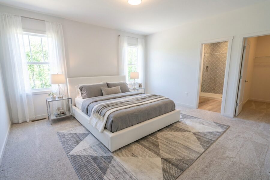 Main-level Primary Suite - digitally staged